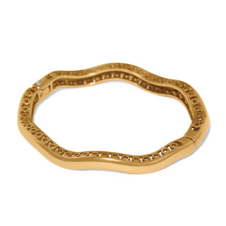 Brighton gold wavy hinged bangle bracelet with circular cutout inner edge detail