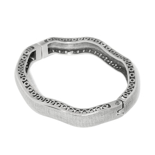 Brighton silver-tone wide hinged bangle bracelet with circular cutout border detail