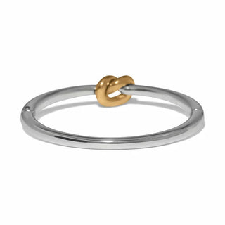 Two-tone silver and gold Interlok hinged bracelet top-down view of knot detail