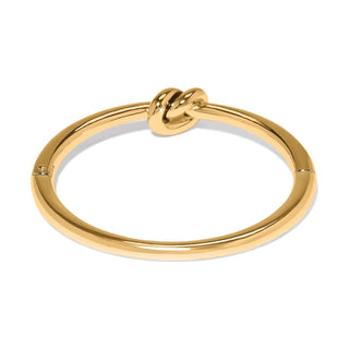 Brighton Interlok Single Knot Hinged Bangle in polished gold with decorative knot detail