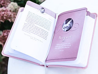 Jesus Calling devotional book open to August chapter in pink leathersoft binding with scripture references