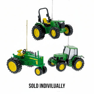 Three John Deere tractor Christmas ornaments in green and yellow, vintage and modern styles