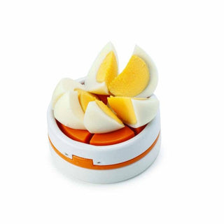 Joie Egg Slice and Wedge tool with freshly sliced hard-boiled egg wedges on top