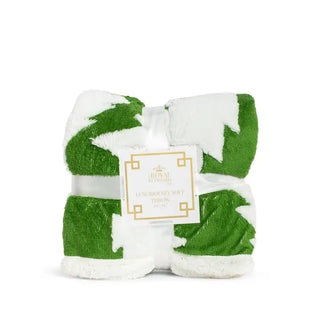 The Royal Standard Jolly Tree throw blanket folded in green and white Christmas tree pattern