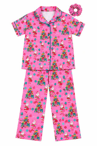 Kids pink Christmas pajama set with Santa print, short sleeve top, pants, and scrunchie
