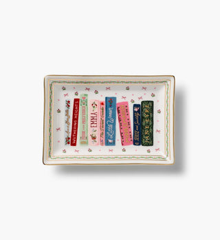 Rifle Paper Co. porcelain catchall tray featuring classic literary book spines on white background with gold trim