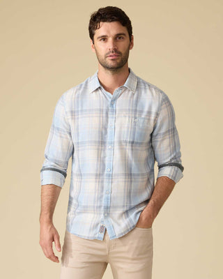 Man wearing Flag and Anthem Ladonia long sleeve plaid shirt in light blue and cream