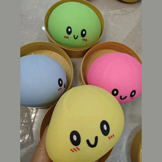 assorted colorful mystery dumpling squishies in bamboo steamers held by hand