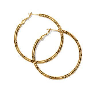 Gold-plated large hoop earrings with black engraved swirls and hinged fishhook closure