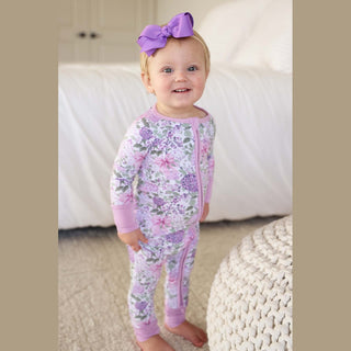 Front view toddler lavender floral convertible zip romper with ribbed cuffs and double zipper