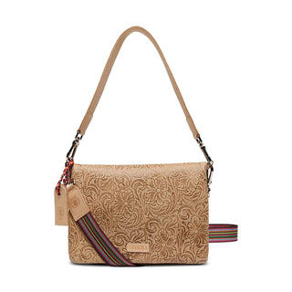 Beige patterned handbag with a colorful strap 