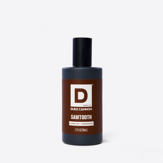 Duke Cannon Sawtooth cologne spray bottle in matte black, Alpine Air and Cedarwood, 1.7 fl oz