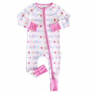 White Caden Lane Little Sister baby romper full length front view with pink zipper and brand tag