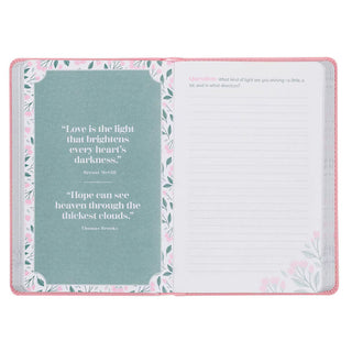 Open pink faux leather devotional with teal quote pages and journaling space
