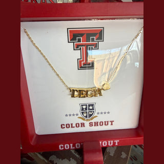 Texas Tech gold bar necklace with tag charm on red display stand