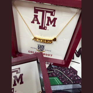 Texas A&M Aggies gold bar necklace with heart charm in maroon gift box