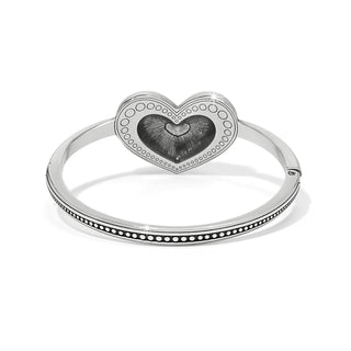 Brighton Love Me Do hinged bangle bracelet in silver with decorative heart centerpiece and dot detailing