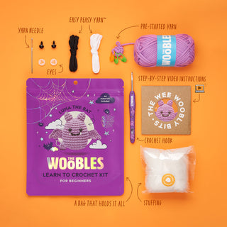 The Woobles Luna the Bat crochet kit contents including yarn, hook, stuffing, and instructions
