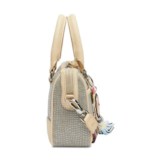Side view of petite Consuela Luncheon handbag showing structured gray dot texture, beige leather trim, and floral keychain detail