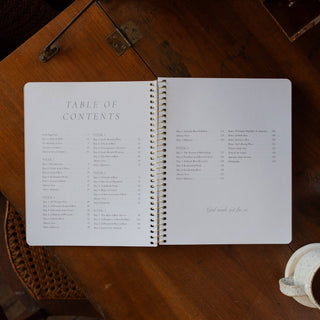 Open spiral Bible study book showing Table of Contents across two white pages