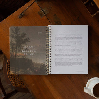 Spiral Bible study open to Week 3 Day 1 God's Resting Place on wood table