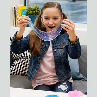 Crazy Aaron Mega Falling Water slime stretched by girl showing iridescent blue purple gradient and star speckles