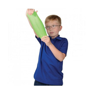 lime green elongated squishy toy stretched by boy showing elasticity