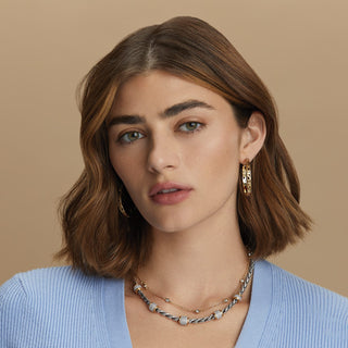 Model wearing Brighton Meridian layered necklaces in silver and gold with crystal accents