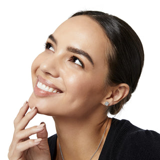 Smiling woman wearing Brighton Meridian Post Earrings, silver square crystal studs on ear.