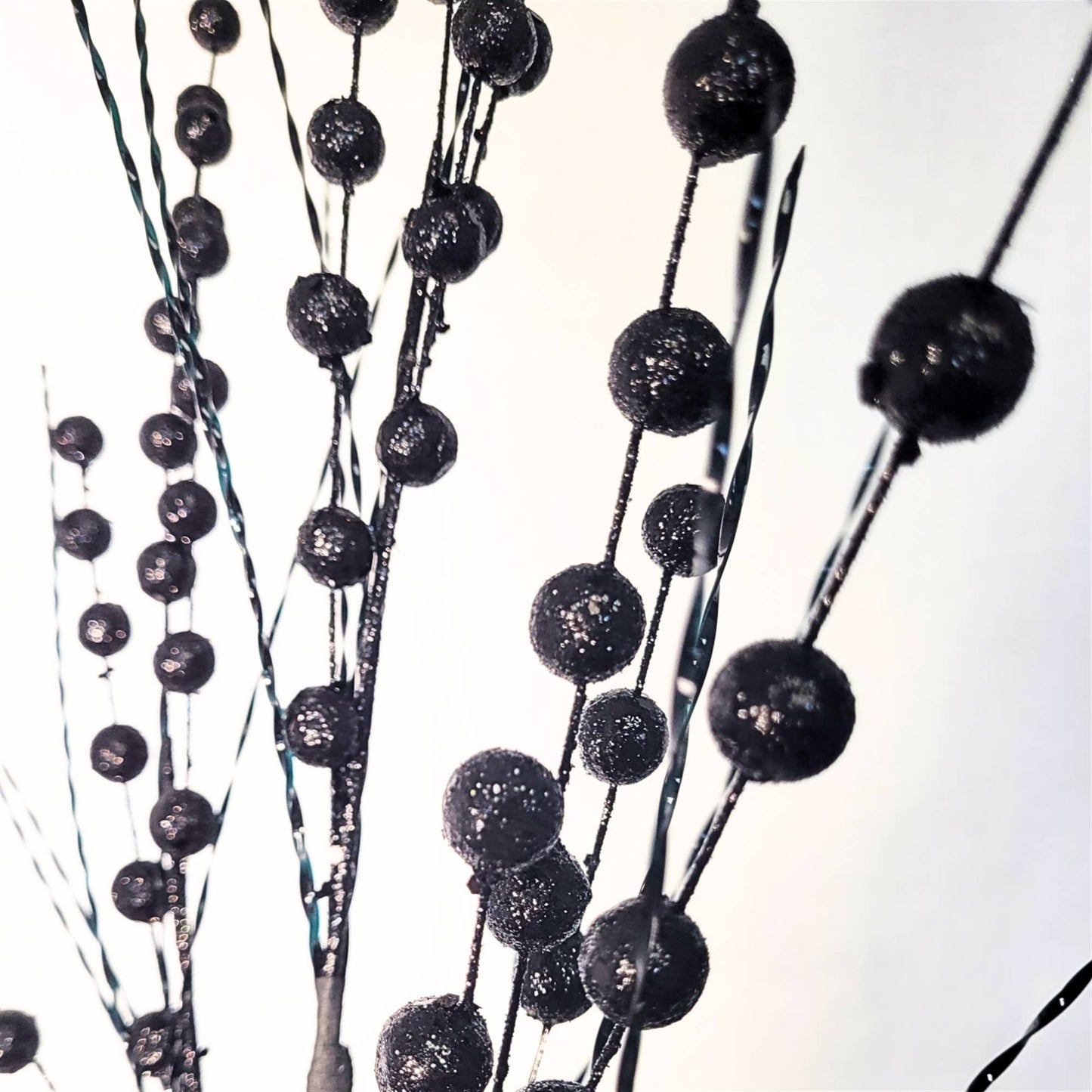 black glitter spray with black balls