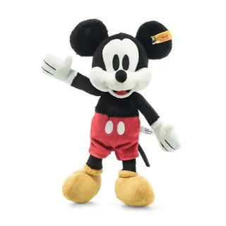 Steiff Mickey Mouse plush toy with red shorts, white gloves, and yellow ear tag