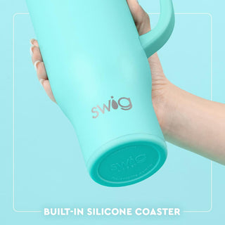 Swig Life 40oz teal tumbler with handle showing built-in silicone coaster bottom