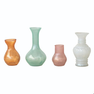 Four glass vases of different colors 