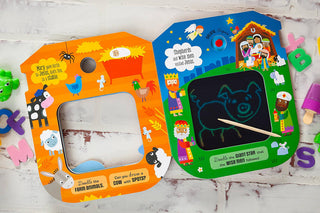Orange farm animal Bible doodle book with pig drawing on LCD screen surrounded by foam letters