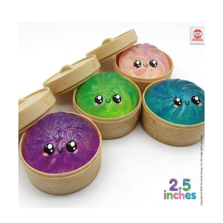 Four galaxy swirl glitter dumpling squishies in mini bamboo steamers showing soft foam texture