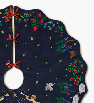 Rifle Paper Co. navy velvet Christmas tree skirt with embroidered florals, stars, angel, and birds