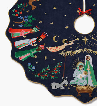 Rifle Paper Co. navy embroidered Christmas tree skirt featuring nativity scene with Three Wise Men and angel