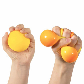 Color Changing NeeDoh squishy toy in orange to yellow gradient being squeezed by hands