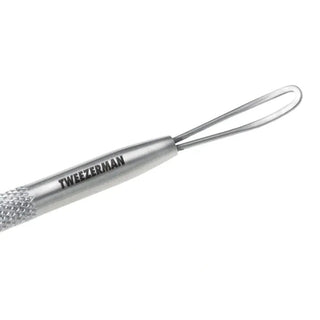 Tweezerman stainless steel blackhead remover with diamond-textured grip and engraved logo