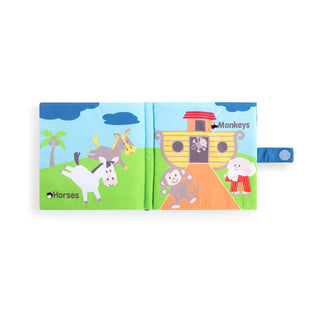 Open pages of Noah's Ark soft sound book showing horses and monkeys with ark illustration
