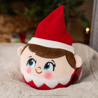 Round plush Scout Elf Boy toy with red hat, brown hair, and blue eyes