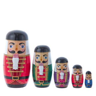 Set of five nutcracker-themed wooden nesting dolls in graduating sizes with colorful uniforms