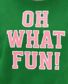 Green mock neck top with pink 'Oh What Fun!' graphic text print