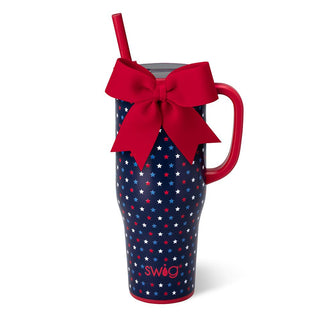 Blue mug with red star pattern, red handle, and red bow 