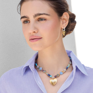 Model wearing Brighton One Heart Multi Heart Bead Necklace with gold heart pendant and colorful beads