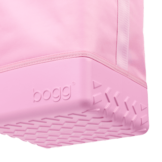 Close-up of Bogg Bag Original Half Brrr in Pink Taffy showing textured rubber base and logo