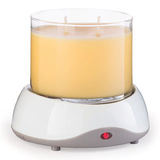 Candle Warmers electric candle warmer with white base, red indicator light, and large three-wick candle.