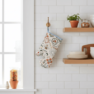 Home Sweet Home Oven Mitt styled hanging in kitchen