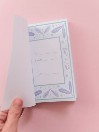 Inside cover of 100 Things I Love About You journal showing To, From, and Date fields with floral border