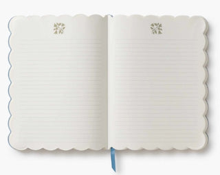 White notebook with scalloped edges 